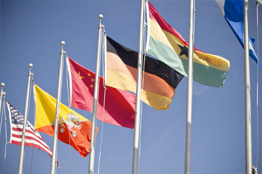 international flags flying in the breeze